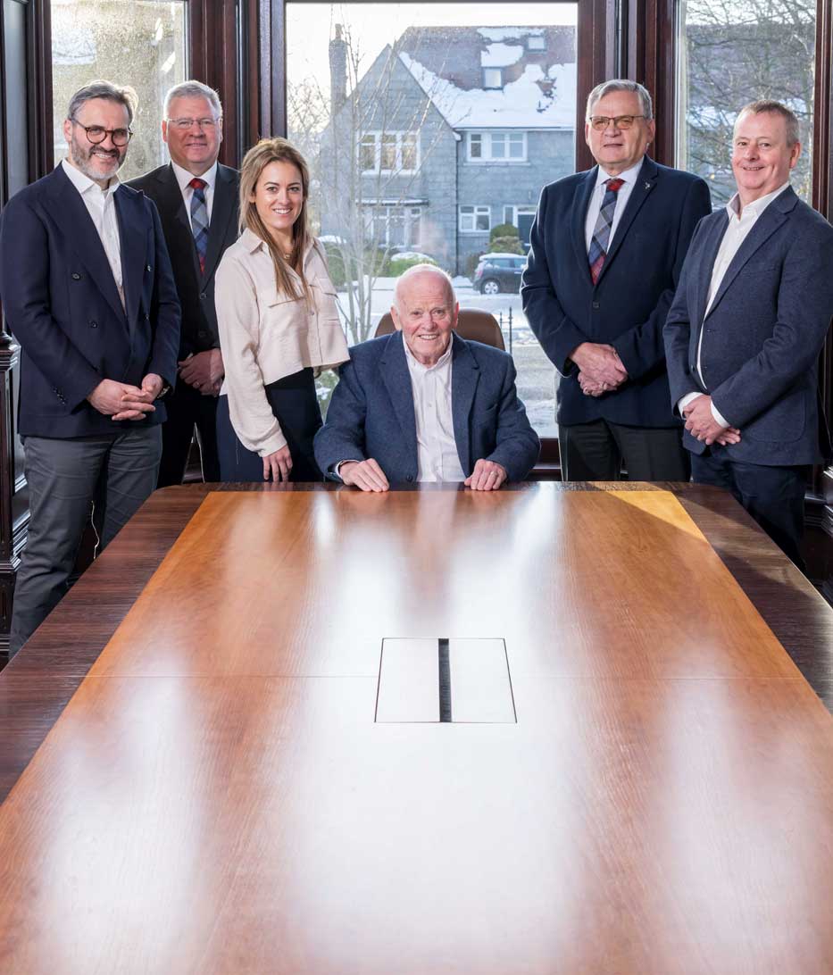 Balmoral Group board members in boardroom